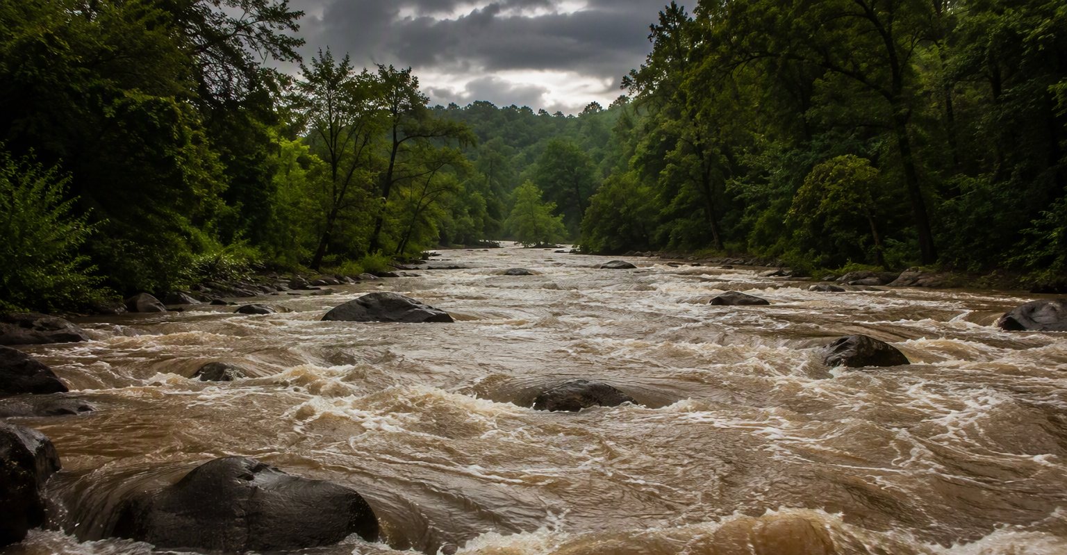 A rocky Upstate river running high and muddy after heavy rain
